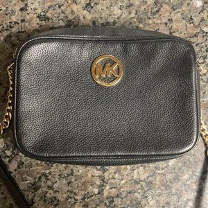 Michael Kors black leather cross body bag.